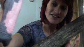 Stunning ginger-haired country lass fucked by enormous horse