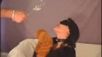 Petite woman jerks off the dog's penis and swallows its semen