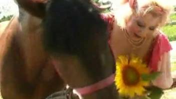 Busty mature lady has outdoor intercourse with a horse and gives a messy blowjob