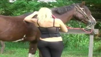Sexy blonde whore slides whole horse penis in her tight holes