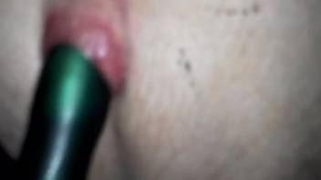 Guy bangs a canine's snug snatch with his dildo