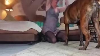 Dog licks and fucks skinny woman while on cam