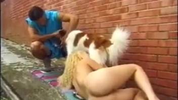 Curly-haired Latina woman has sex with the dog in front of her boyfriend.