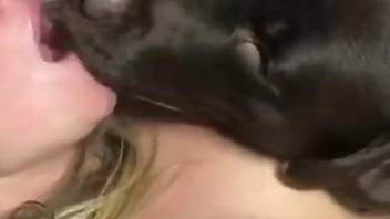 Masked bitch making out with a dog during hot banging