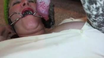 Voluptuous older lady fellates the canine's phallus amid domestic depravities broadcast live