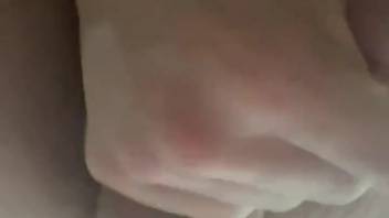 Guy masturbates his penis while a dog's erection is inside him