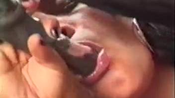 Dark-haired woman performs a satisfying oral sex on a well-hung stallion